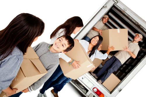 Same day removals team loading boxes in Shepherds Bush