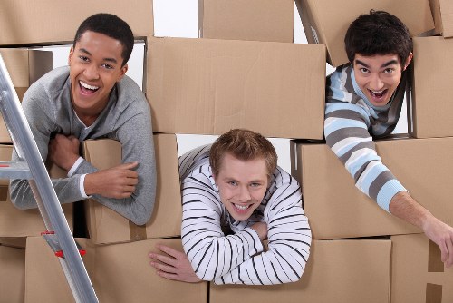 Trained movers handling furniture during a Shepherds Bush relocation