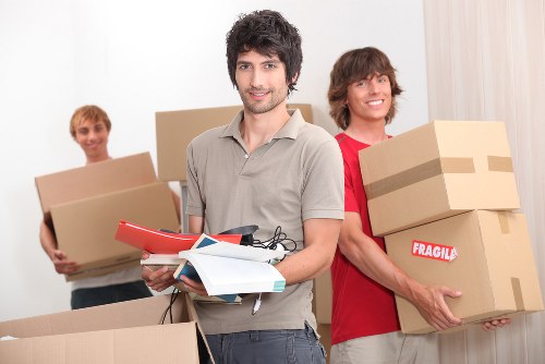 Moving team handling sofas and household furniture in Shepherdsbush