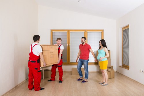 Shepherdsbush man and van transporting furniture and boxes
