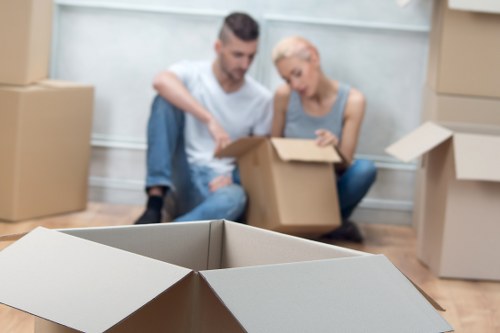Van unloading furniture and boxes during a Shepherds Bush relocation