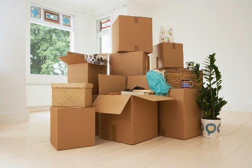 Loading furniture and boxes into a moving truck in Shepherds Bush