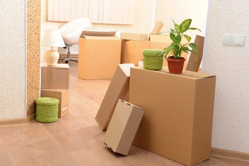 Mover carrying boxes during a Shepherds Bush relocation