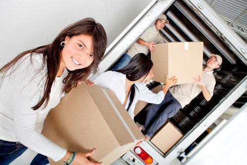Loading furniture into a removal truck in Shepherdsbush